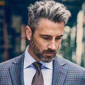 Short Sides Fade Haircut With Volume On The Top.
